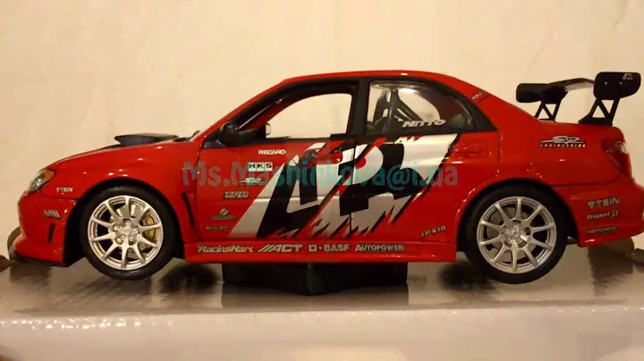 Машина –модель металл Welly 1:24 Subaru Impreza